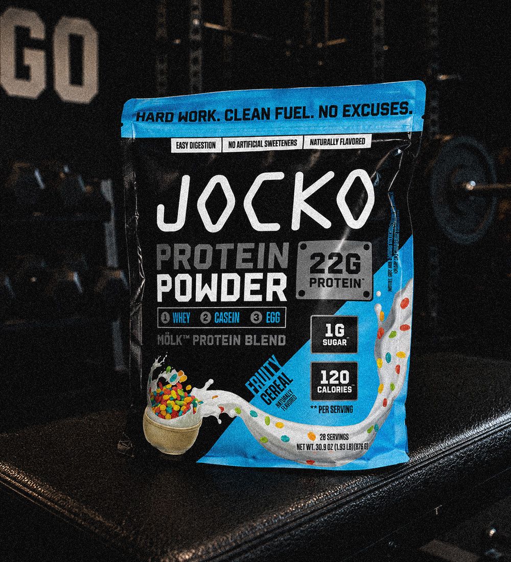A bag of Jocko Protein Powder standing on a gym bench