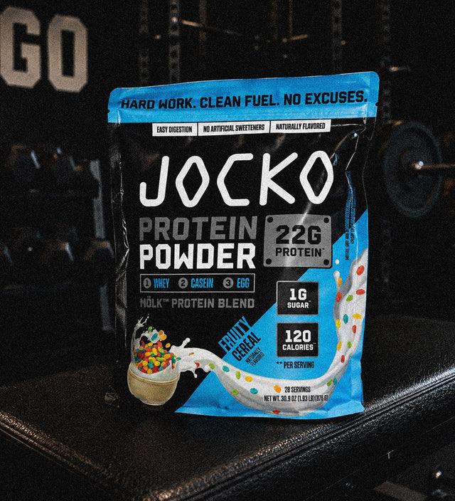 A bag of Jocko Protein Powder standing on a gym bench