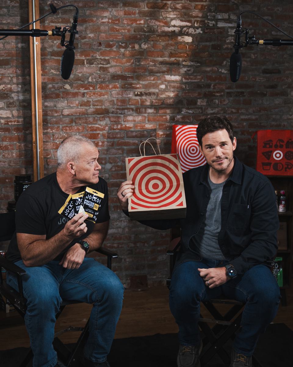 Jocko Willink and Chris Pratt holding a Target bag